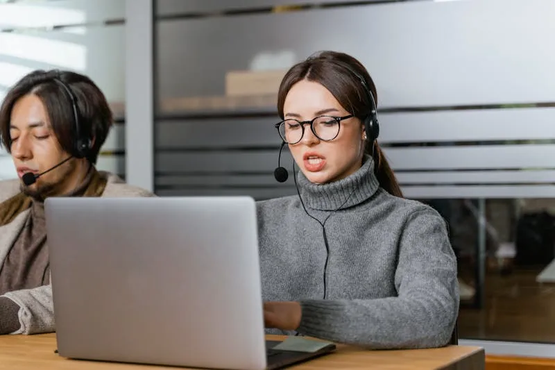 Customer service professional with laptop and chat support
