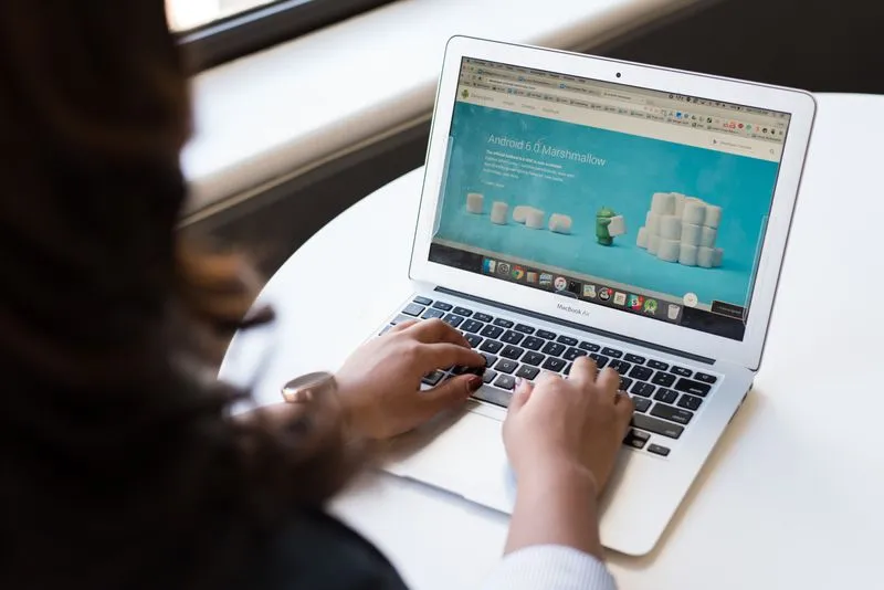 A drag-and-drop website builder template on a laptop screen