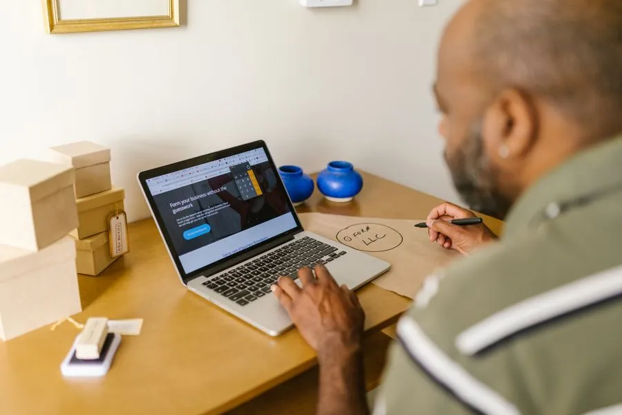 Small business owner building a website on a laptop in Nigeria