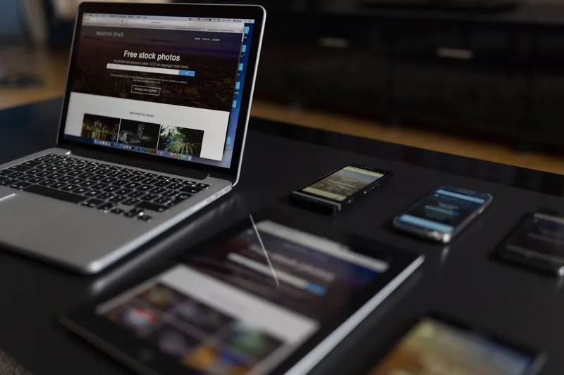 A responsive website layout shown on laptop and mobile screens