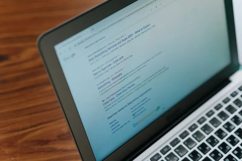 Person typing a query into Google search