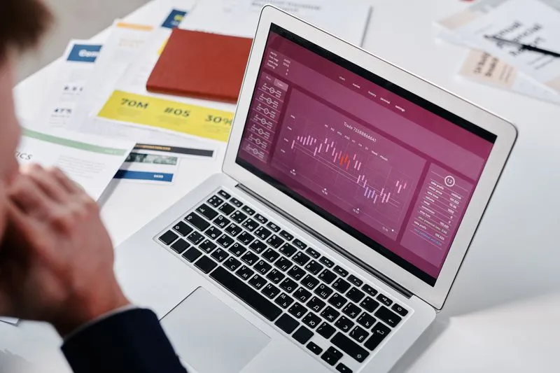 Reviewing campaign performance data on a laptop