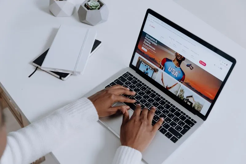 Marketer setting up a search ad campaign on a laptop