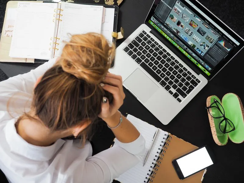 Business owner frustrated at a laptop