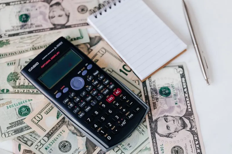 Calculator and budget figures for advertising cost