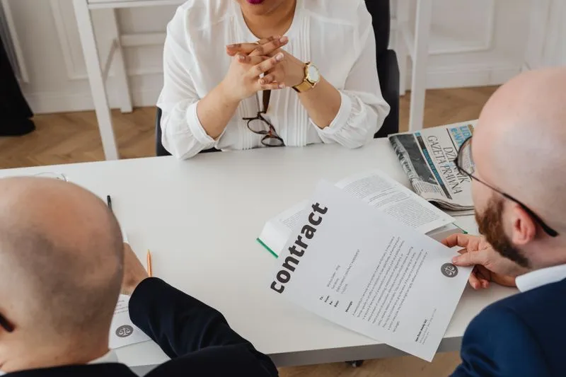 Reviewing a marketing agency's results and proposal in a meeting
