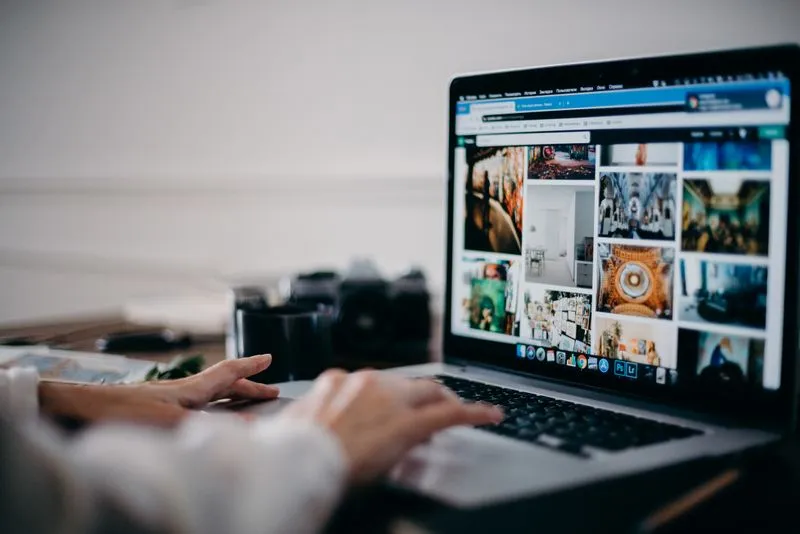 Website image gallery loading on a laptop screen