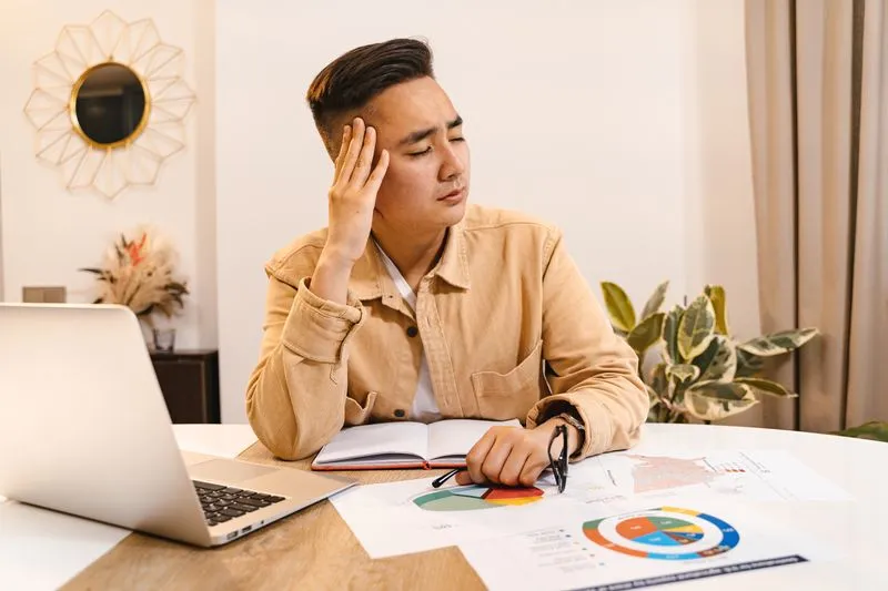 Business owner reviewing a website problem at a desk