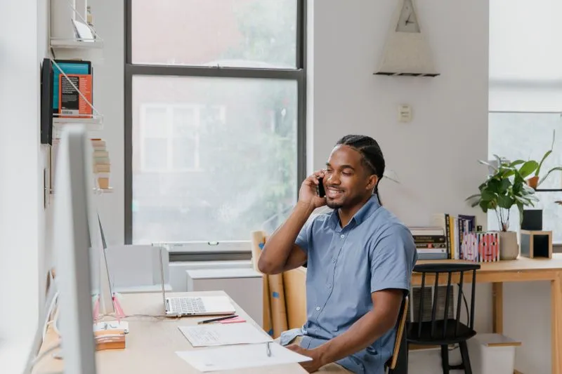 Small business owner working at a simple desk