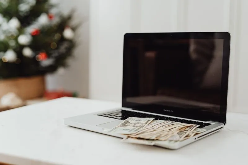 Laptop showing online earnings dashboard