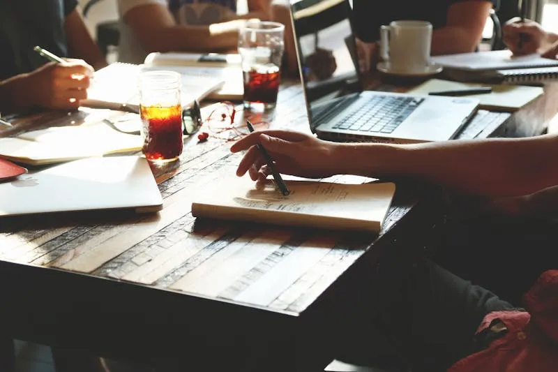 Person brainstorming blog topic ideas in a notebook