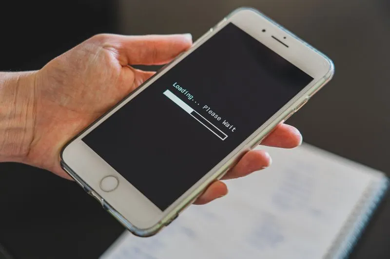 Person waiting for a website to load on a smartphone
