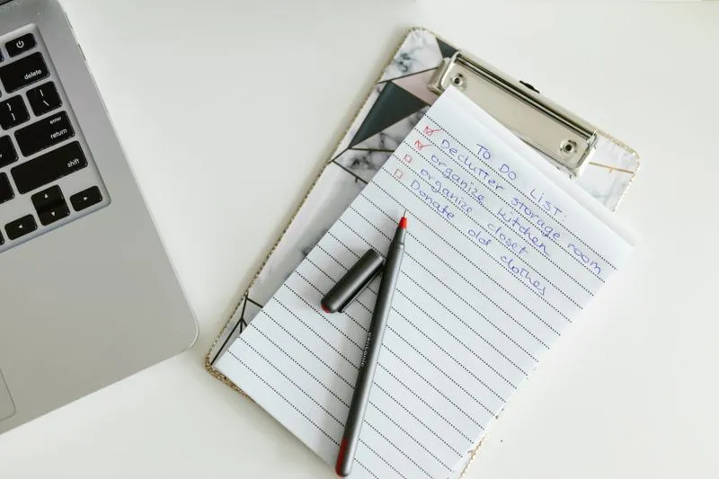 Technical audit checklist beside a laptop