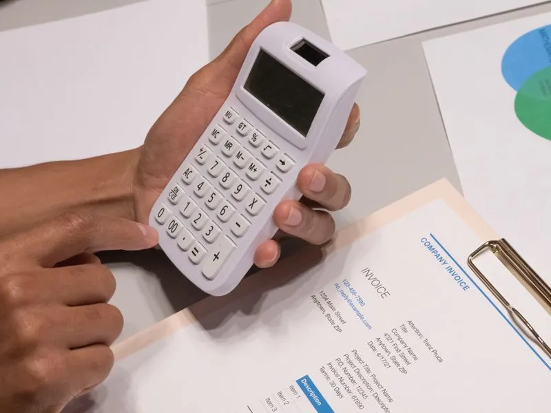 Calculator and budget documents on a desk